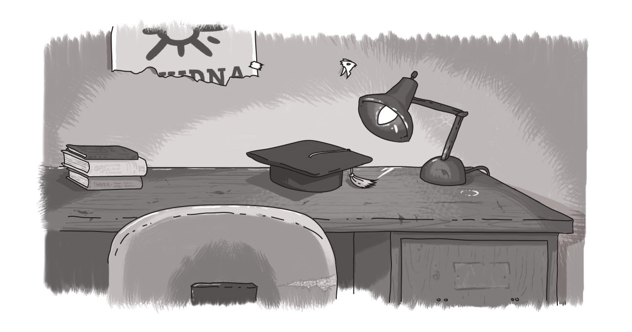 An image of a school desk with a mortarboard on it.