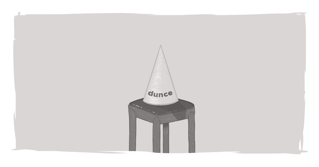 A dunce cap sitting on an empty chair.