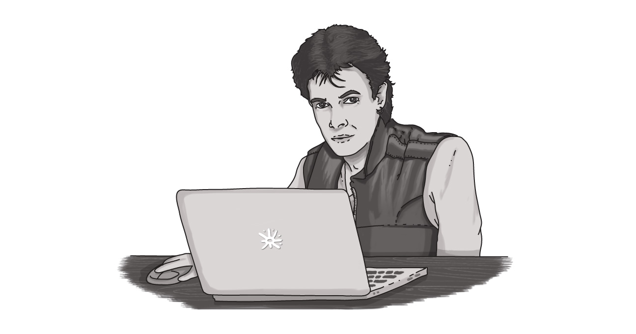 An image of Rick Springfield, singer of Human Touch, behind a laptop.