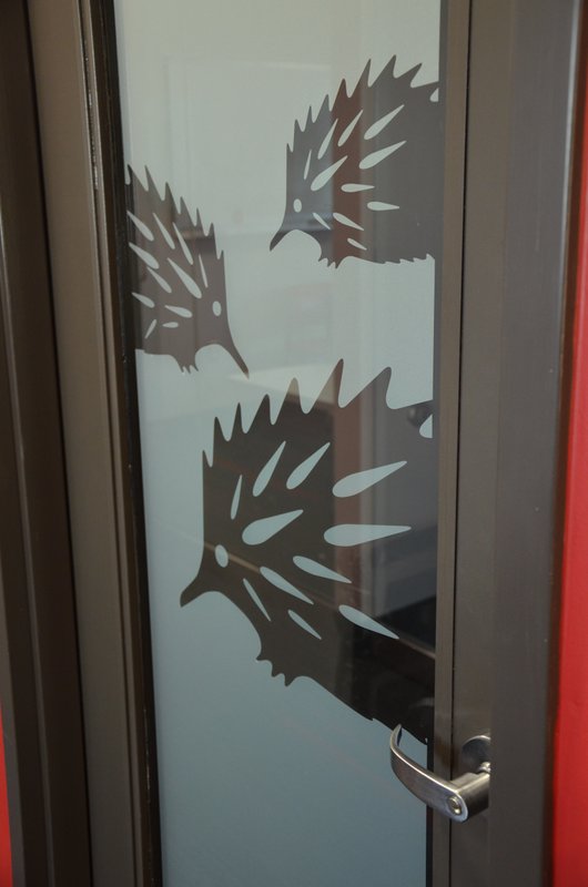 Echidna branding on a door.