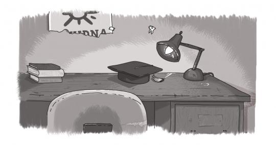 An image of a desk, with a mortarboard on top.