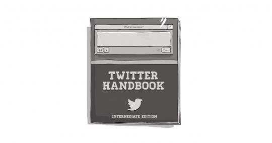 A book bearing the title "Twitter Handbook"